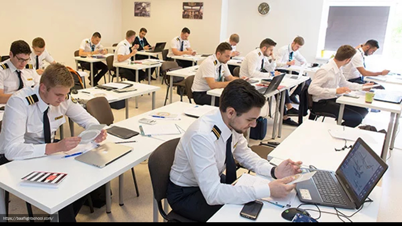 Photograph of a group of uniformed airline pilots in a classroom